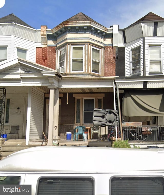 4813 N 11th St, Philadelphia, PA 19141 - view of front facade featuring a porch and brick siding