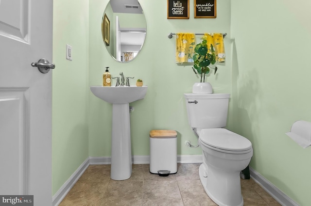 922 S Macon St, Baltimore, MD 21224 - bathroom with toilet and tile patterned flooring