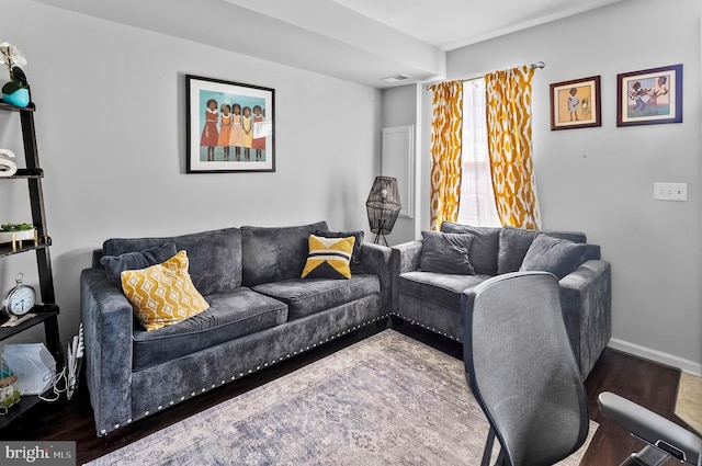 922 S Macon St, Baltimore, MD 21224 - living room featuring wood finished floors and baseboards
