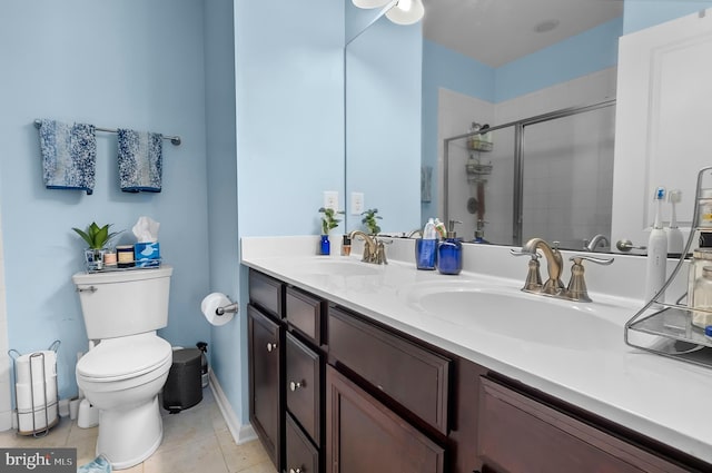 922 S Macon St, Baltimore, MD 21224 - bathroom featuring double vanity, a shower stall, and tile patterned floors