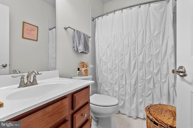 922 S Macon St, Baltimore, MD 21224 - full bathroom featuring vanity, tile patterned floors, and a shower with shower curtain