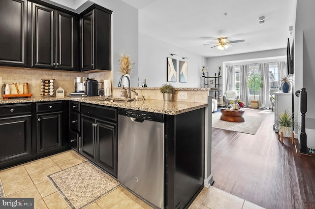 922 S Macon St, Baltimore, MD 21224 - kitchen featuring dark cabinetry, stainless steel dishwasher, ceiling fan, and a peninsula