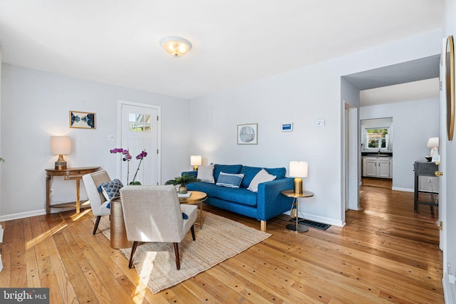127 Fowler Ave, Haddonfield, NJ 08033 - living area with light wood-style floors and healthy amount of natural light