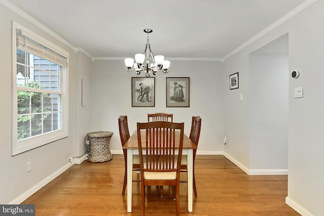 1581 Poplar Grove Dr, Reston, VA 20194 - dining area featuring a chandelier, crown molding, and wood finished floors