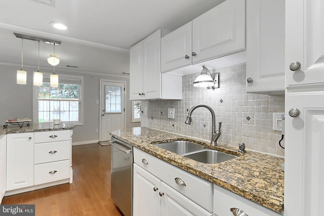 1581 Poplar Grove Dr, Reston, VA 20194 - kitchen with stainless steel dishwasher, white cabinets, wood finished floors, tasteful backsplash, and light stone countertops