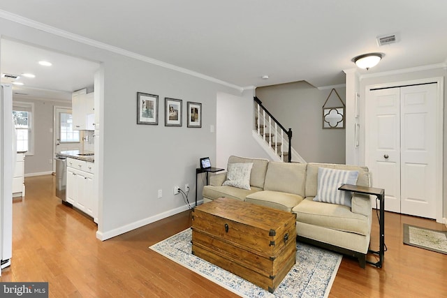 1581 Poplar Grove Dr, Reston, VA 20194 - living area featuring light wood-type flooring, ornamental molding, stairway, and recessed lighting