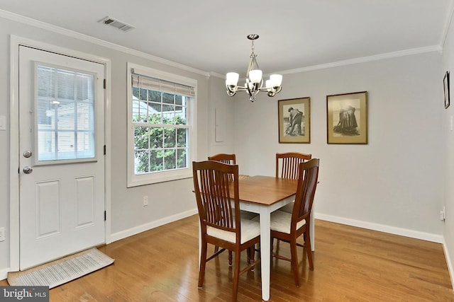 1581 Poplar Grove Dr, Reston, VA 20194 - dining area featuring ornamental molding, a chandelier, and wood finished floors