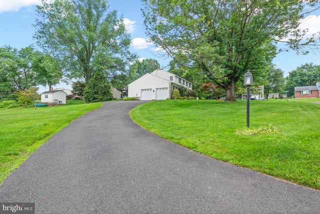 11 Creek Rd, Southampton, PA 18966 - view of front facade with a front yard and a garage