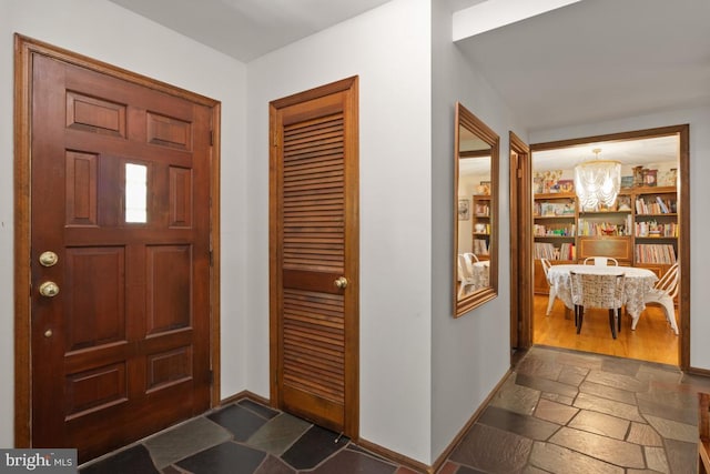 11 Creek Rd, Southampton, PA 18966 - entryway featuring stone tile floors and a chandelier