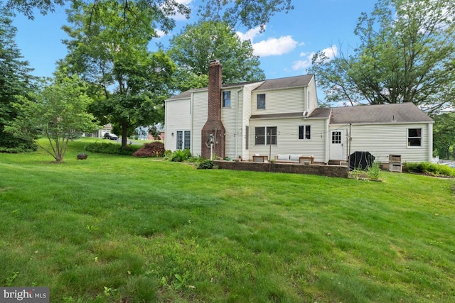 11 Creek Rd, Southampton, PA 18966 - back of house featuring a chimney, a lawn, and a patio area