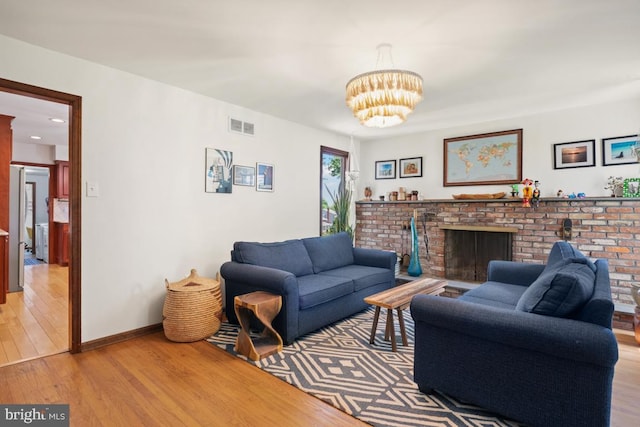 11 Creek Rd, Southampton, PA 18966 - living room featuring light wood-style flooring, a chandelier, a fireplace, and recessed lighting