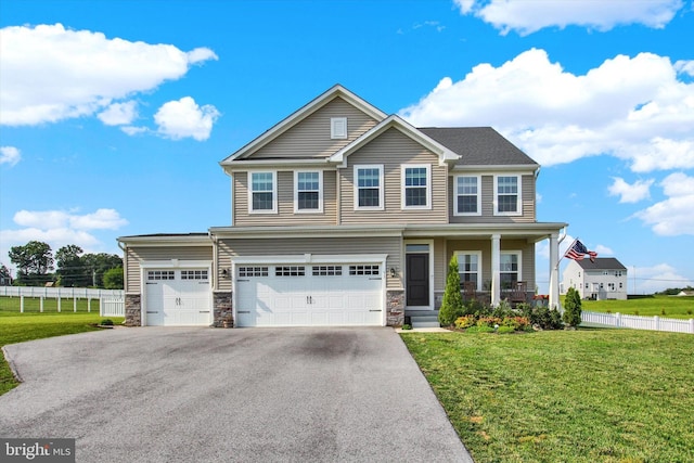 33 Winifred, Hanover, PA 17331 - view of front facade with stone siding, driveway, covered porch, and an attached garage