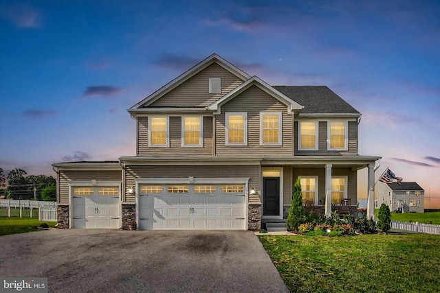 33 Winifred, Hanover, PA 17331 - view of front of house with covered porch, stone siding, driveway, and a garage