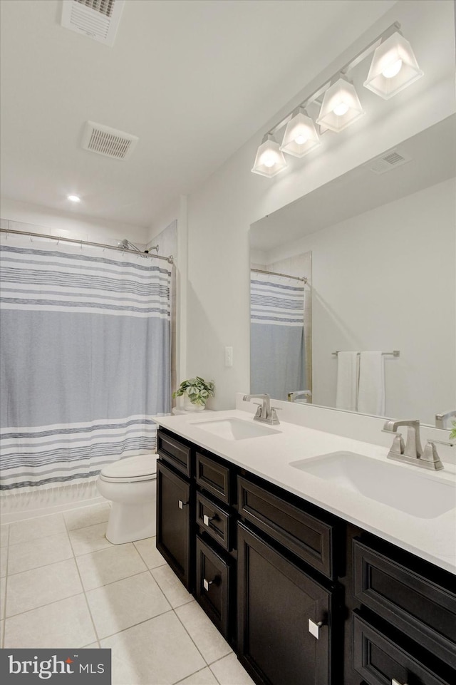 33 Winifred, Hanover, PA 17331 - bathroom with double vanity, tile patterned floors, and curtained shower