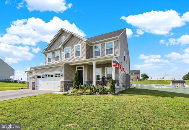 33 Winifred, Hanover, PA 17331 - view of front of home featuring a garage, covered porch, concrete driveway, and stone siding
