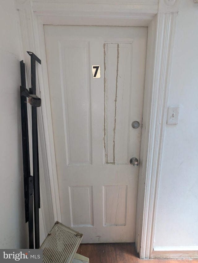 311 Calhoun St, Baltimore, MD 21223 - doorway to outside featuring wood finished floors