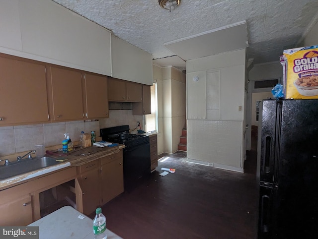 311 Calhoun St, Baltimore, MD 21223 - kitchen featuring black appliances, dark wood-style floors, and tasteful backsplash