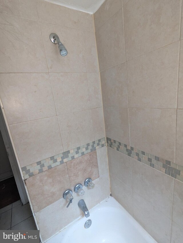 311 Calhoun St, Baltimore, MD 21223 - full bath with tile patterned flooring and bathing tub / shower combination