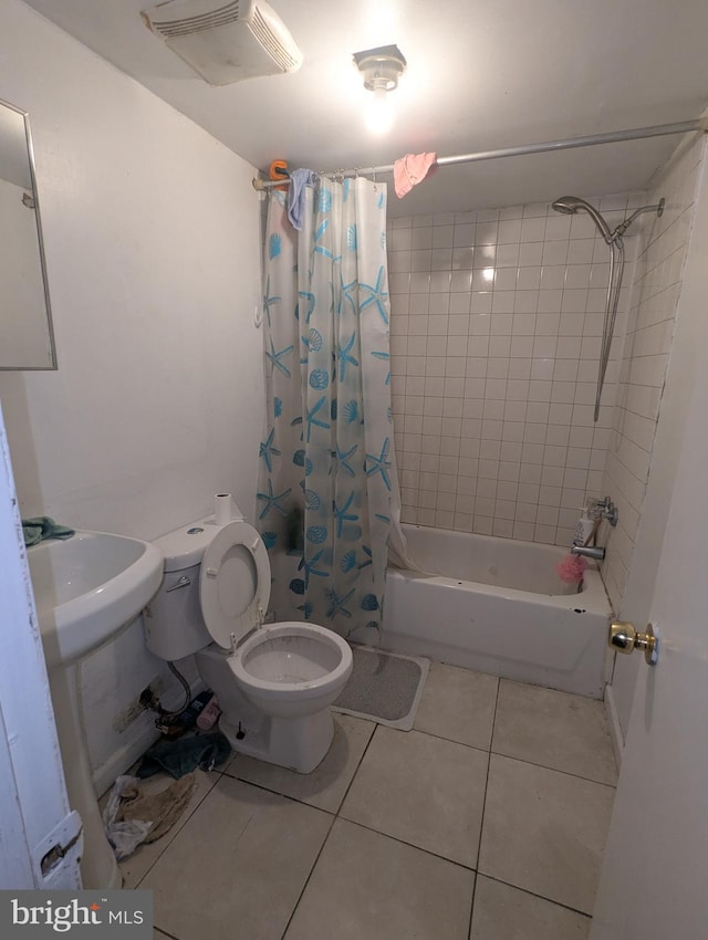 311 Calhoun St, Baltimore, MD 21223 - full bath featuring tile patterned flooring and shower / bathtub combination with curtain
