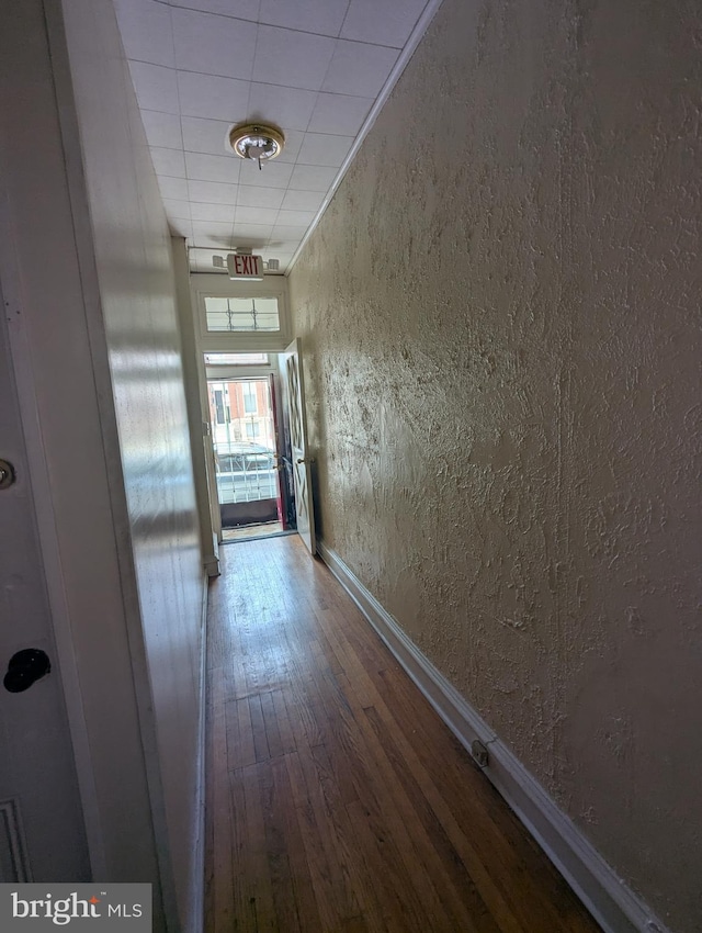 311 Calhoun St, Baltimore, MD 21223 - corridor with a textured wall and wood finished floors