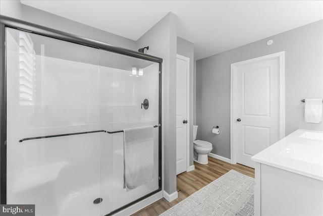 300 Hayward Ct, Pottstown, PA 19464 - full bathroom with wood finished floors, a shower stall, and double vanity