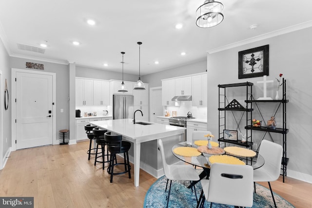 44691 Wellfleet Dr Unit 306, Ashburn, VA 20147 - dining area featuring ornamental molding, recessed lighting, and light wood-style flooring