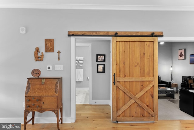 44691 Wellfleet Dr Unit 306, Ashburn, VA 20147 - interior space with a barn door and wood finished floors