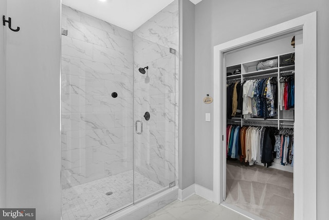 44691 Wellfleet Dr Unit 306, Ashburn, VA 20147 - full bathroom featuring marble look tile flooring, a marble finish shower, and a spacious closet