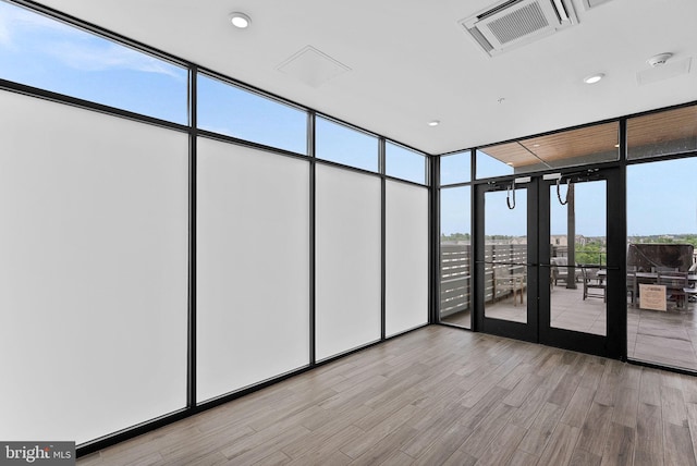 44691 Wellfleet Dr Unit 306, Ashburn, VA 20147 - unfurnished sunroom featuring french doors