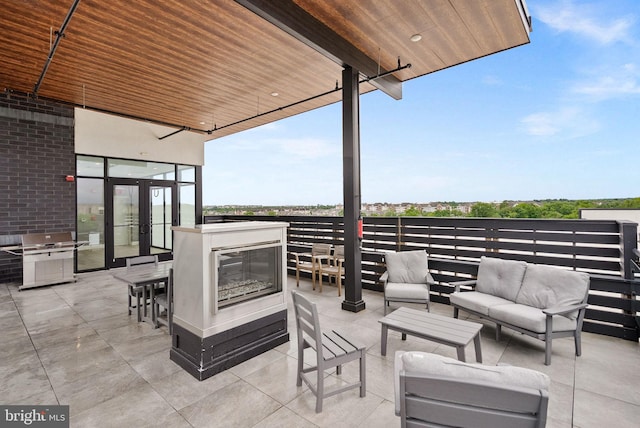 44691 Wellfleet Dr Unit 306, Ashburn, VA 20147 - view of patio / terrace with an outdoor hangout area and a grill