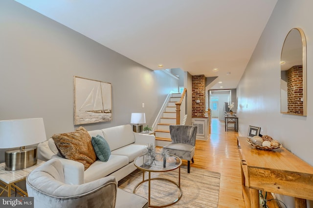 12 S Castle St, Baltimore, MD 21231 - living room with light wood finished floors and stairway