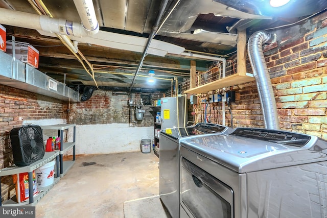 12 S Castle St, Baltimore, MD 21231 - unfinished basement with washer and dryer and brick wall
