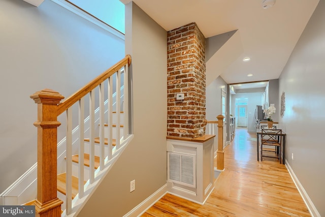 12 S Castle St, Baltimore, MD 21231 - staircase with wood finished floors and recessed lighting
