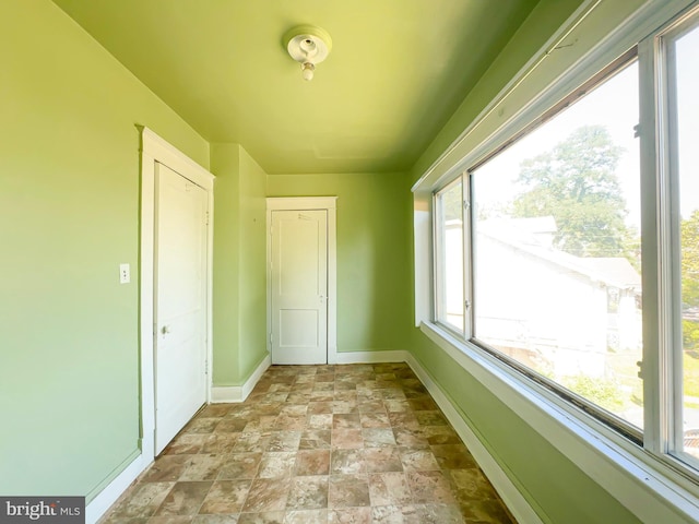2636 Rhode Island Ave NE, Washington, DC 20018 - unfurnished room with baseboards and light stone finish flooring