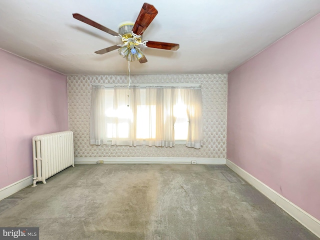 2636 Rhode Island Ave NE, Washington, DC 20018 - carpeted spare room featuring radiator heating unit, ceiling fan, and wallpapered walls