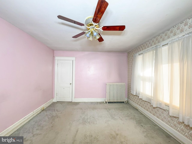 2636 Rhode Island Ave NE, Washington, DC 20018 - empty room featuring radiator heating unit, a ceiling fan, carpet flooring, and wallpapered walls