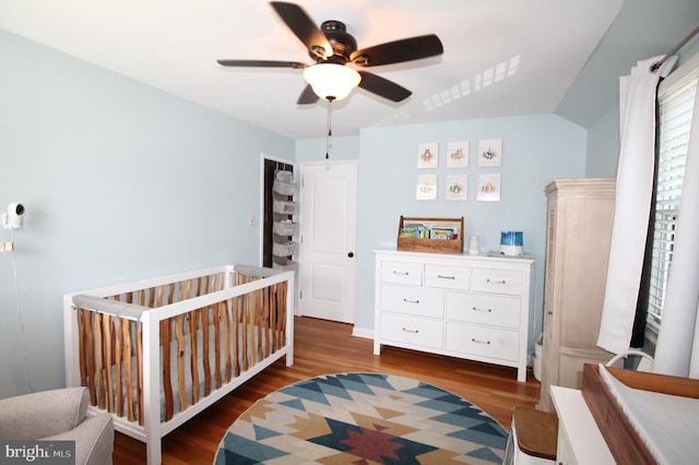 243 Pinehurst Rd, Wilmington, DE 19803 - bedroom with wood finished floors, a crib, and a ceiling fan