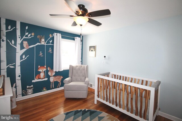 243 Pinehurst Rd, Wilmington, DE 19803 - bedroom featuring wood finished floors, a crib, and ceiling fan