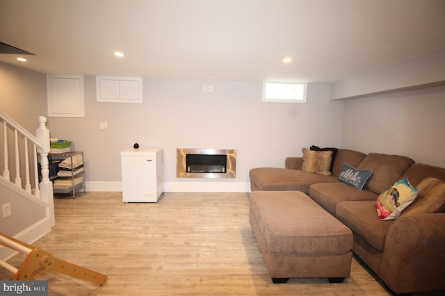 243 Pinehurst Rd, Wilmington, DE 19803 - living area with light wood-style floors, recessed lighting, stairs, heating unit, and a glass covered fireplace