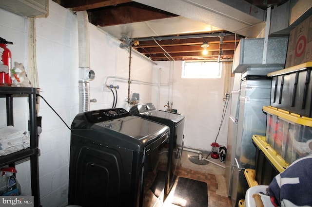 243 Pinehurst Rd, Wilmington, DE 19803 - laundry room with washer and clothes dryer and concrete block wall