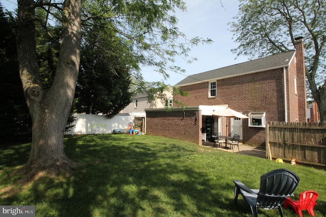 243 Pinehurst Rd, Wilmington, DE 19803 - rear view of house with brick siding and a chimney