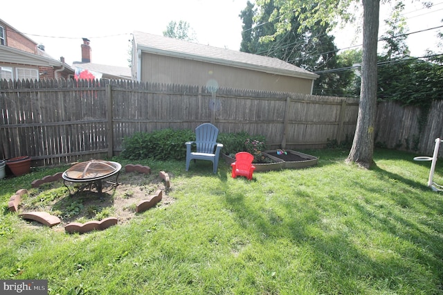 243 Pinehurst Rd, Wilmington, DE 19803 - fenced backyard with an outdoor fire pit