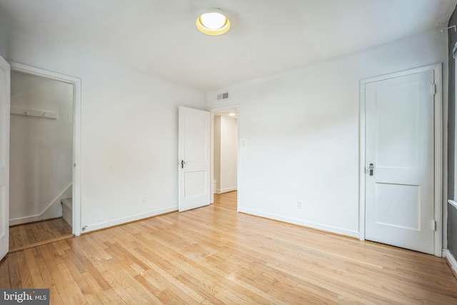 304 S Veitch St, Arlington, VA 22204 - unfurnished bedroom with light wood-style floors and baseboards