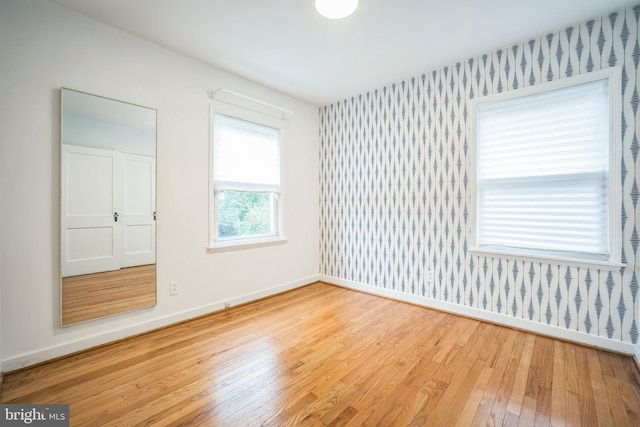 304 S Veitch St, Arlington, VA 22204 - empty room with wallpapered walls and wood finished floors
