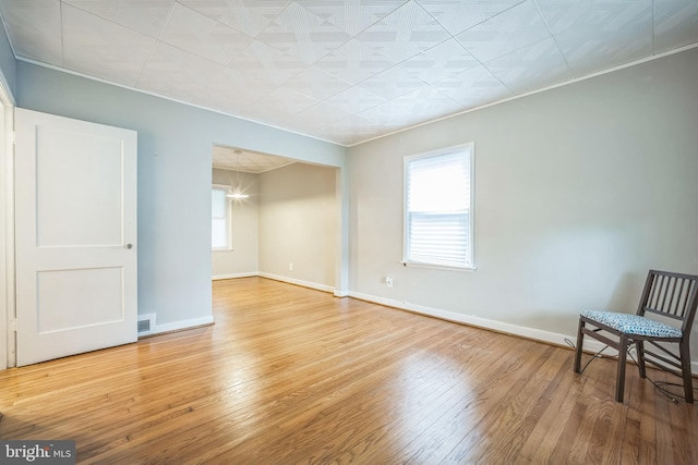304 S Veitch St, Arlington, VA 22204 - spare room featuring wood-type flooring, ornamental molding, and a chandelier