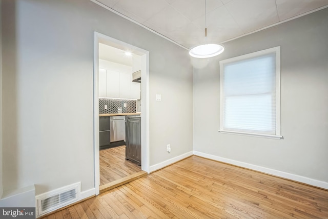 304 S Veitch St, Arlington, VA 22204 - unfurnished dining area with light wood-style floors and ornamental molding