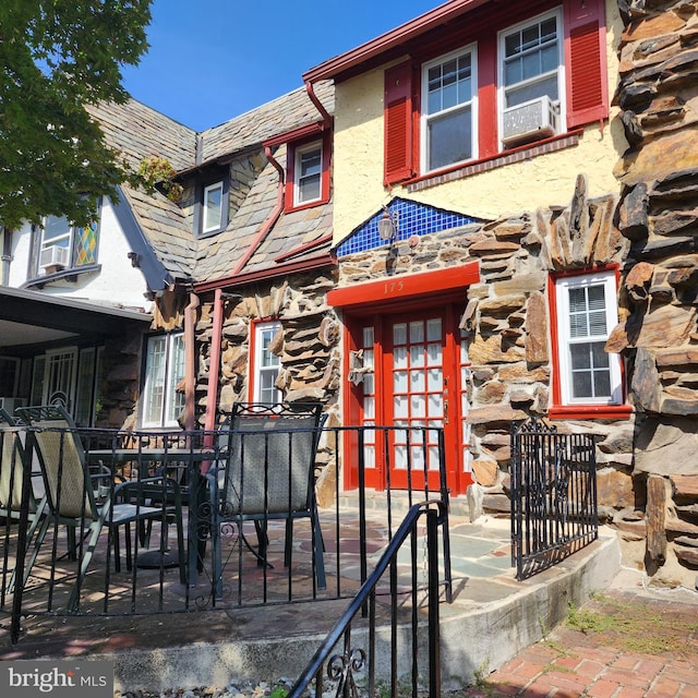 175 Stoneway Ln, Bala Cynwyd, PA 19004 - view of front of home with stone siding and a patio area