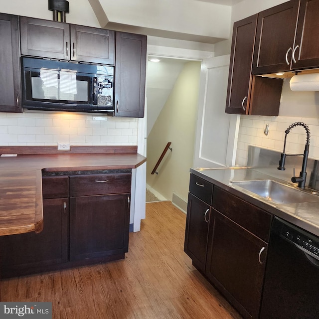 175 Stoneway Ln, Bala Cynwyd, PA 19004 - kitchen featuring black appliances, tasteful backsplash, light wood finished floors, and dark brown cabinetry