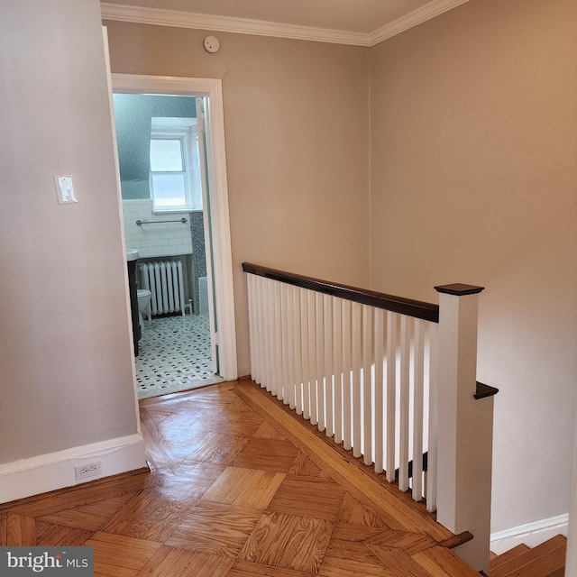 175 Stoneway Ln, Bala Cynwyd, PA 19004 - hall featuring radiator heating unit, crown molding, and an upstairs landing
