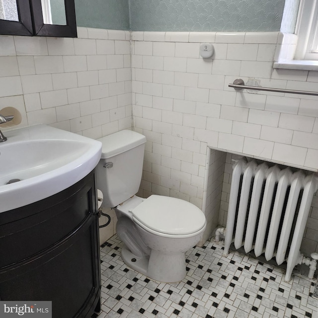 175 Stoneway Ln, Bala Cynwyd, PA 19004 - bathroom featuring radiator heating unit, tile walls, vanity, and tile patterned floors